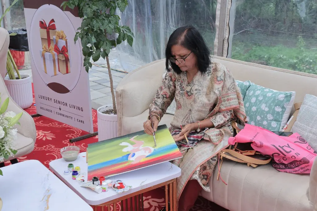 Senior resident participating in art and creative wellness activities at CHL Urja luxury senior living